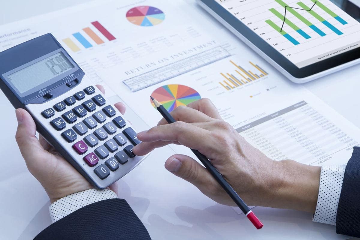 ROI charts with calculator and tablet